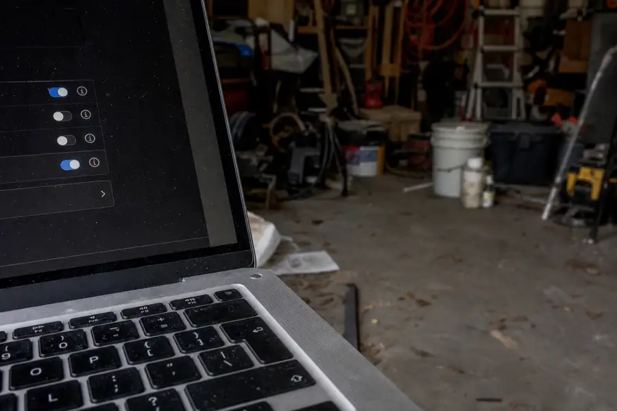 Options on a laptop with a junk-filled garage behind