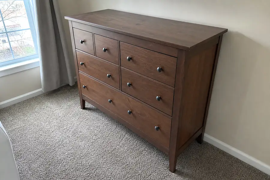 Person photographing a dresser for online resale